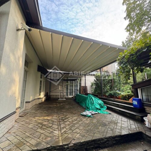 Фотографии выполненных работ компании «ABIE-GROUP» Алюминиевой перголы со сдвижным тентом и led подсветкой. г.Москва